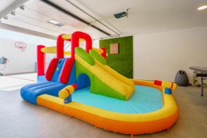 a play room with an inflatable slide at Chill Villa - Signature by Paradise Portugal in Mariquiteira
