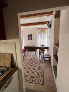 a kitchen with a table and a dining room at La Terrazza Sul Monte in Monte San Savino