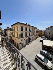 a group of buildings and cars parked in a parking lot at La Terrazza Sul Monte in Monte San Savino