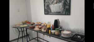a counter with a bunch of food on it at its hotel in Itapetinga