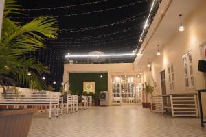 a dining room with a table and chairs and lights at House M Lodge in Sawāi Mādhopur +20 photos
