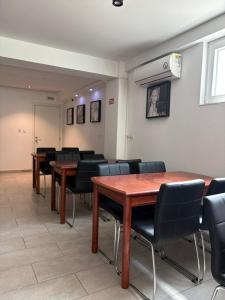 a conference room with tables and chairs in a room at VilaMihaela in Skopje