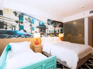 מיטה או מיטות בחדר ב-Caravel Hotel