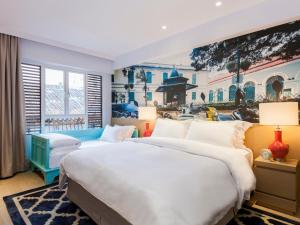 מיטה או מיטות בחדר ב-Caravel Hotel