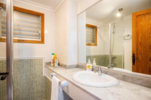 a bathroom with a sink and a mirror at Can Figó in Alcudia +22 photos