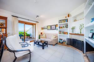 a living room with a couch and a tv at Can Figó in Alcudia
