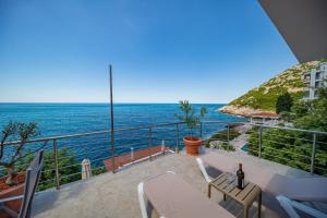 a balcony with a view of the ocean at Perfect Seaview Two-bedroom Apartment Tramontana in Dobra Voda