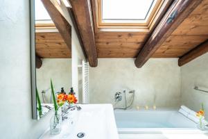 a bathroom with a tub and a sink at Ca' Del Monastero 9 Collection Spacious Apartment up to 5 Guests in Venice