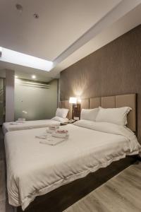 Postel nebo postele na pokoji v ubytování Hotel Trillium