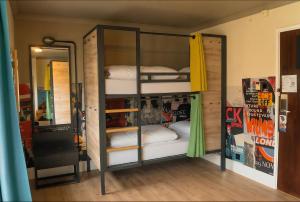 a bunk bed with two bunk beds in a room at a&o London Docklands Riverside in London