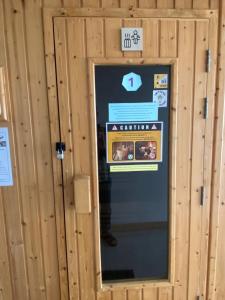 a door to a building with a sign on it at Modern Condo Infinity Pool Gym Near Beach in Bang Sare +17 photos