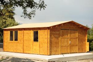 a wooden shed with a large door at TAU Rooms Srl in Tricesimo