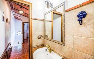 a bathroom with a sink and a mirror at Casa La Seguiriya in Las Lagunillas +3 photos