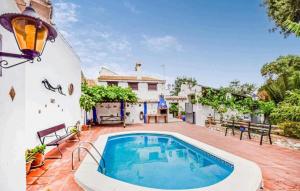 a swimming pool in the backyard of a house at Casa La Seguiriya in Las Lagunillas