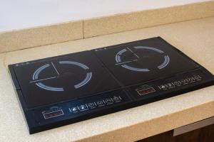 a kitchen counter with a control panel on a counter at Tulum Paradise - Private Pool & Rooftop Deck in Tulum