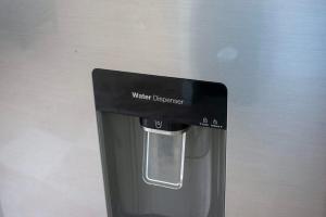 a water dispenser on top of a coffee machine at Tulum Paradise - Private Pool & Rooftop Deck in Tulum