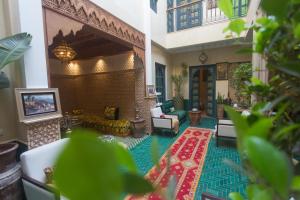a lobby of a house with a living room at Riad Atrium & Spa in Marrakesh