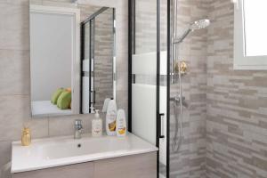 a bathroom with a sink and a shower at Monolocale Aurea 5 in Nardò +22 photos
