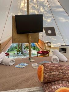 a flat screen tv sitting in a tent at Re dream suite a tema - Rapallo in Rapallo