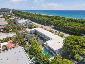 an aerial view of a building and the ocean at King Suite, Private Beach Path, Pool & Hot Tub in Boca Raton