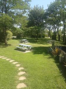 a group of picnic tables in a park at Bungalow tonga in Moncetz-lʼAbbaye