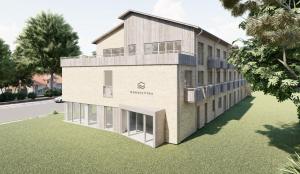 an architectural rendering of a house with a lawn at Nordic Vida Hotel in Cuxhaven