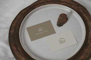 a plate with a rock on top of it at Nordic Vida Hotel in Cuxhaven