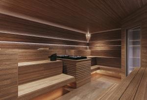 a sauna with wooden walls and wooden floors at Nordic Vida Hotel in Cuxhaven