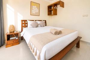 Un pat sau paturi într-o cameră la Family friendly 3BR Poolvilla Central Seminyak Mayyah +46 fotografii