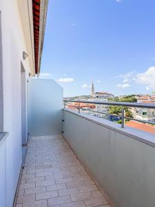 a balcony with a view of the city at Hotel 13 de Outubro By Umbral in Fátima