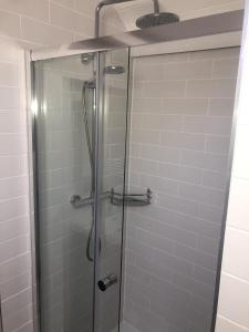 a shower stall with a glass shower door at Wells House & Gardens Self Catering 3 Bedrooms & Sofa Bed Sleep8 in Glenranny +27 photos