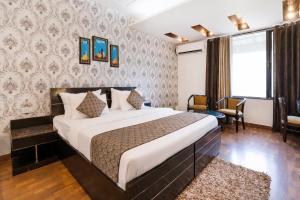 a bedroom with a large bed in a room at Skylark Hotel by Gabrian Hotels in Gurgaon +28 photos