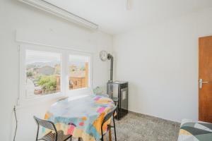 a white room with a table and a window at Pisito de Pueblo I I in Navaluenga