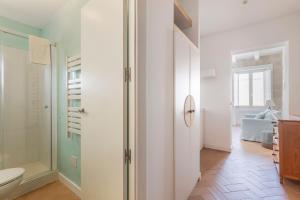 a bathroom with a toilet and a walk in shower at Suite 3 in Mahón +12 photos