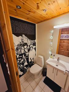 a bathroom with a toilet and a sink at Beautiful apartment in Sinnes E12 in Dirdal +24 photos