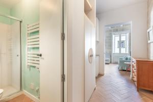 a bathroom with a shower and a glass door at Suite 2 in Mahón