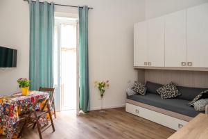 a living room with a couch and a table at Chez Moi in Trapani