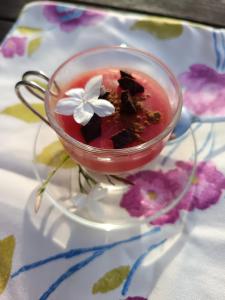 a glass cup with a flower on top of it at Agri Experience - Case Gentile in Castelvetrano Selinunte +47 photos