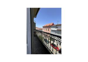 a view of a balcony from a window at Casa Quixote, Centro Catedral in Braga