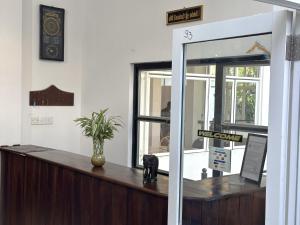 a cashier counter in a store with a window at White House Galaha in Galaha Town
