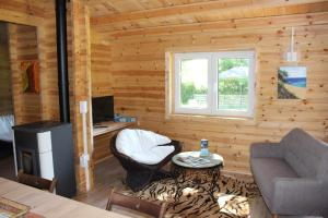 a living room with a couch and a table at Chalet Lohr in Lohr