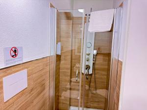a shower with a glass door in a bathroom at Le Chalet Palermo Centro in Palermo +16 photos