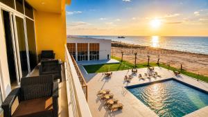 a view of the ocean from the balcony of a hotel at Bosaso Airport Hotel in El Ad