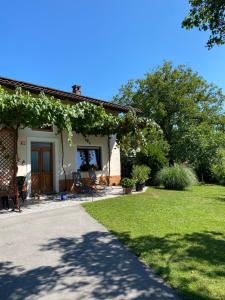 a house with a pathway leading to a yard at Holiday house Katrca in Pivka