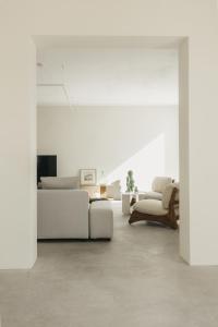 a living room with a couch and a chair at SON MARTORELL by BookMenorcaVillas Unique country house in Mahón