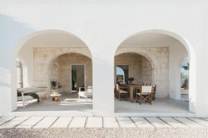 a view of the living room from the courtyard of a house at SON MARTORELL by BookMenorcaVillas Unique country house in Mahón