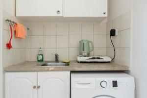 a kitchen counter with a sink and a mixer at Yiorgo's Studios in Kalymnos