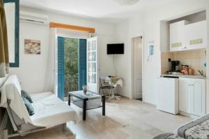 a living room with a couch and a table at Yiorgo's Studios in Kalymnos