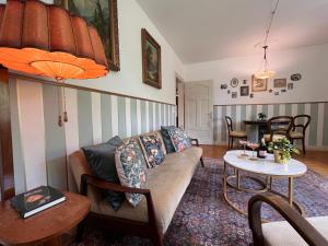 a living room with a couch and a table at Villa Belle in Freudenberg