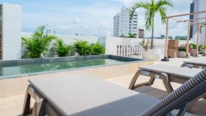 a swimming pool on the roof of a building at Soy Local Centro Histórico in Cartagena de Indias